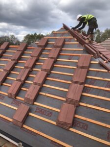 A new tiled pitched roof being installed by a roofing contractor from Southampton Roofers.