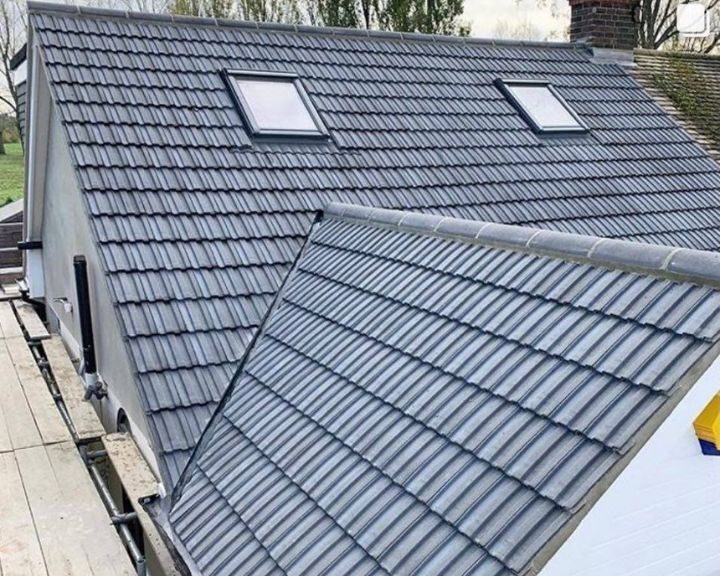 A new roof installation with grey tiles on a house in Southampton.