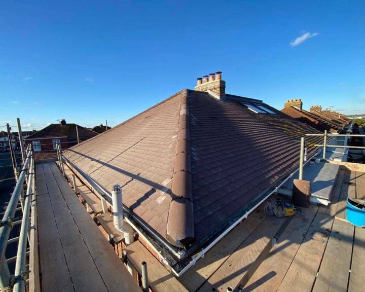 A roof with scaffolding erected to enable roof repairs to be undertaken.