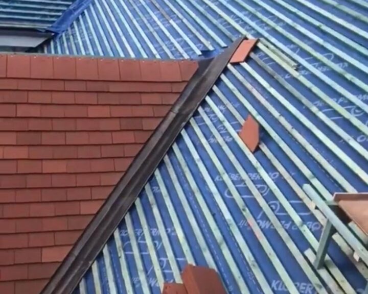 A new tiled roof being installed on a pitched roof by Southampton Roofers.