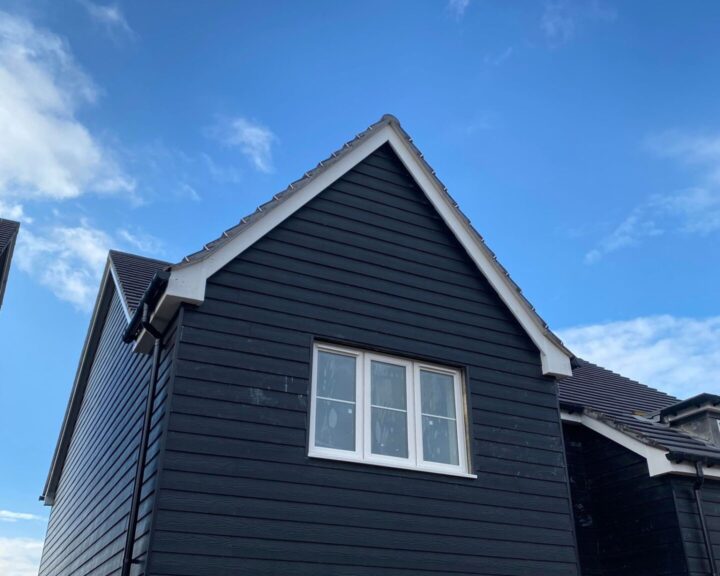 Composite cladding installed on the exterior of a new build house by Southampton Roofers.