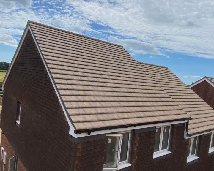 A new pitched roof with guttering and downpipe installed on a house by Southampton Roofers.
